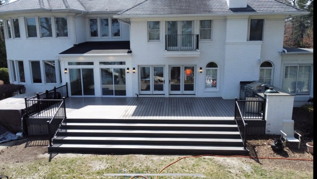 Large house with spacious patio and steps.