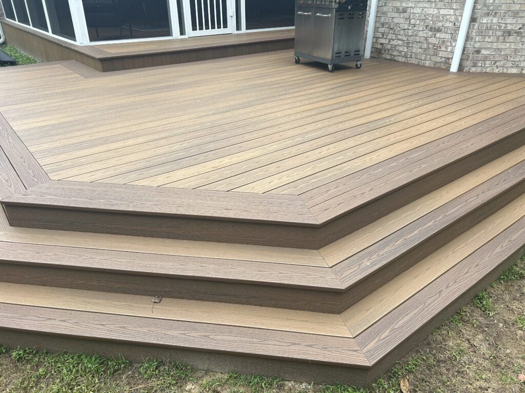 Wooden deck with layered steps outdoors.