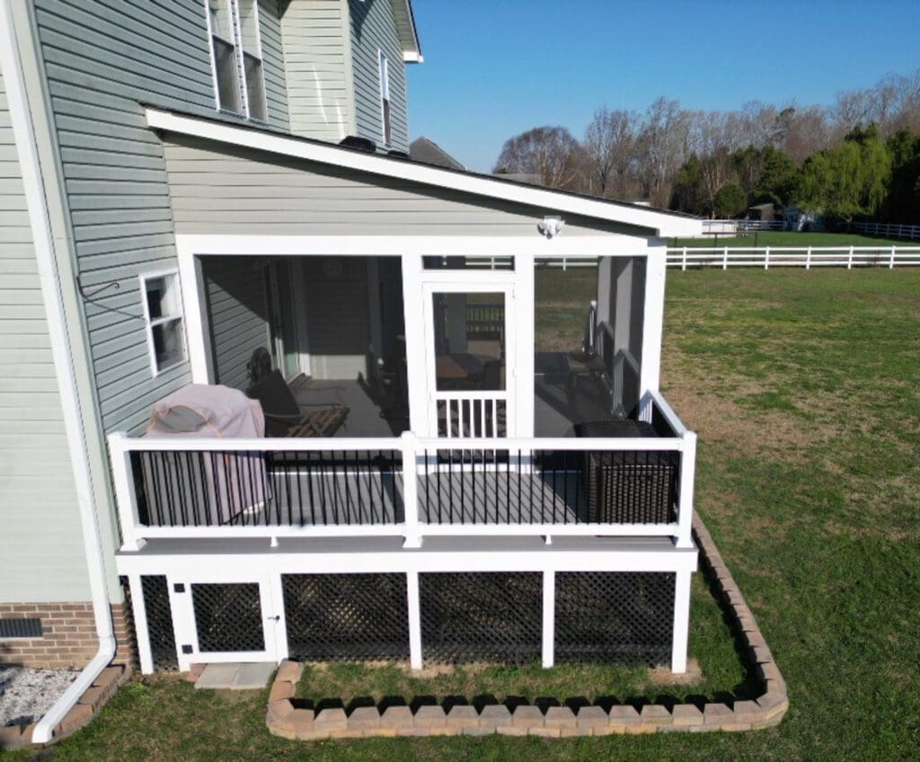 Screened porch with white railing built by B&B Decks in Virginia Beach, VA