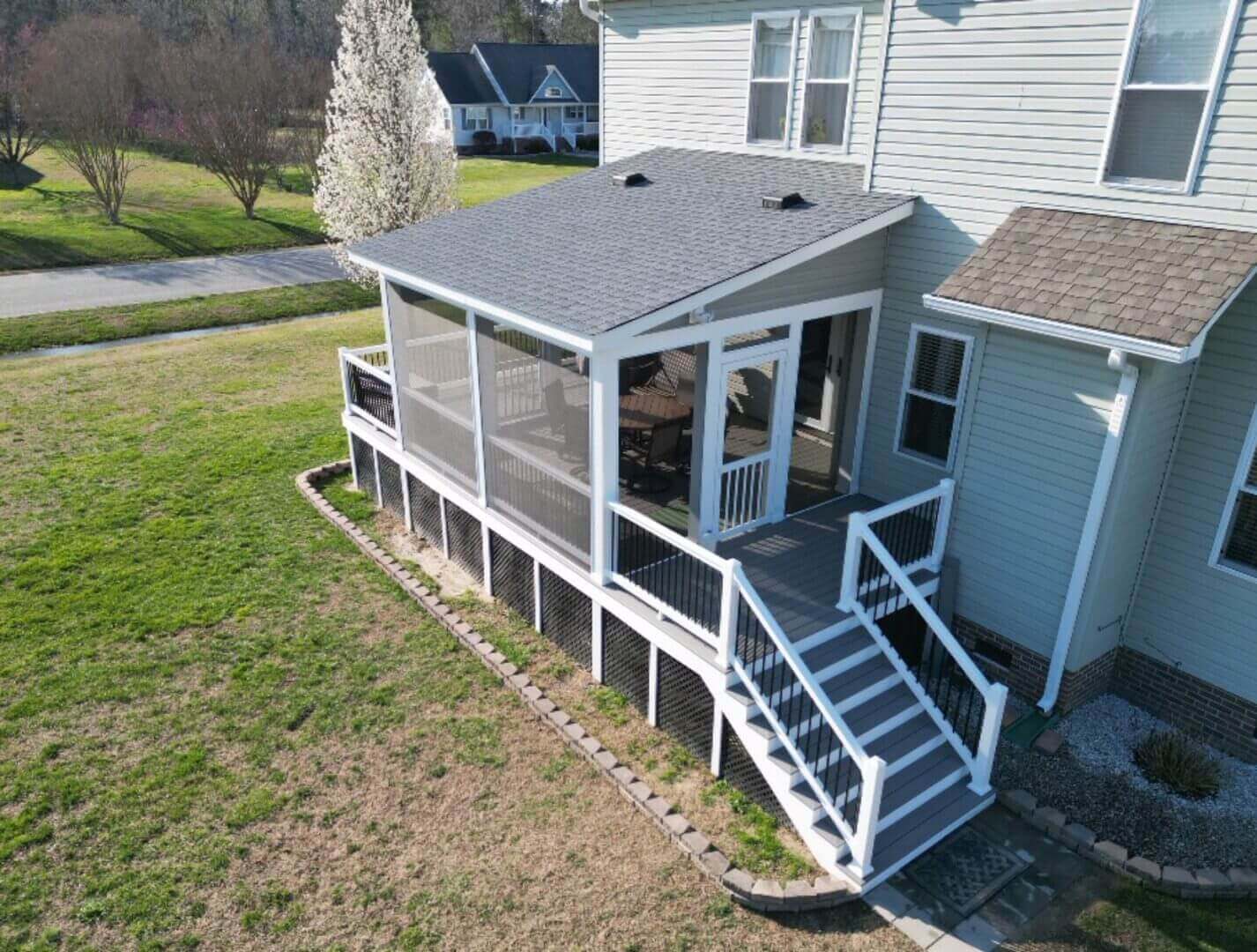 Covered composite deck with screened porch in Moyock, NC