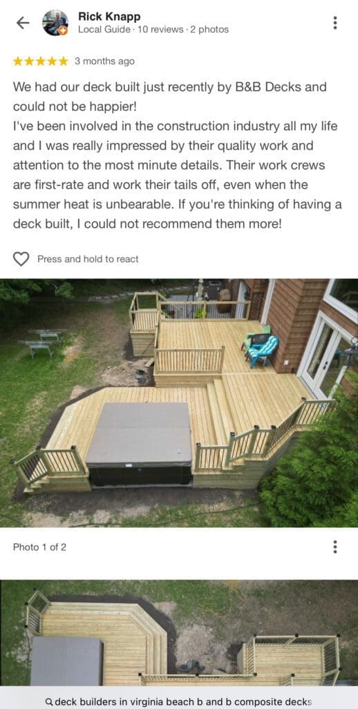 Wooden deck with furniture and surrounding greenery.