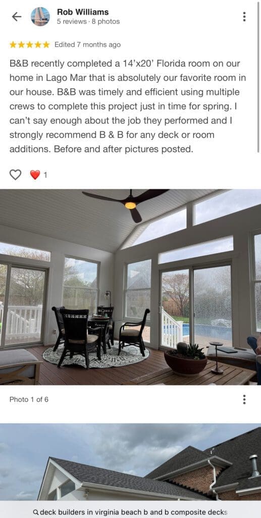 Florida room with large windows and chairs.
