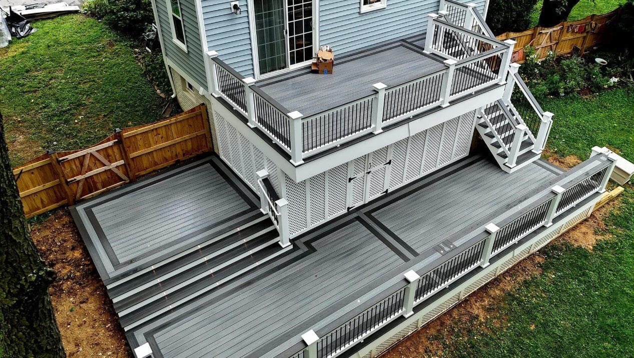 Finished multi-level gray composite deck with railing, built by B&B Decks — Virginia Beach, VA service area