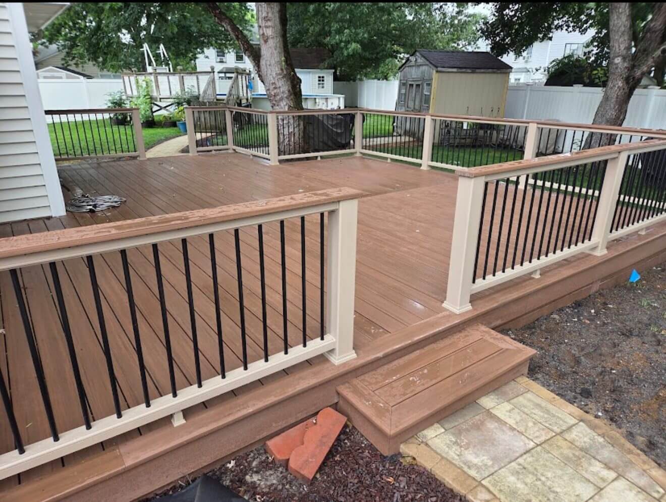 Composite deck on a wooded lot by B&B Decks — Williamsburg, VA service area