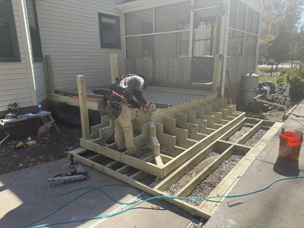 B&B Decks crew building new deck framing and stair stringers on site in Hampton Roads, VA