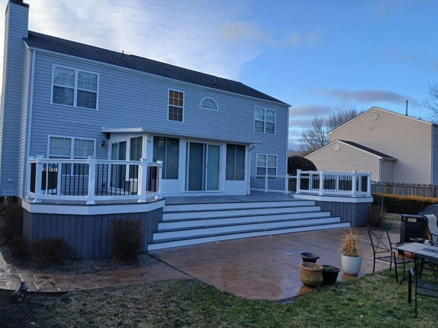 Elevated composite deck at dusk built by B&B Decks on the Peninsula in Hampton Roads, VA